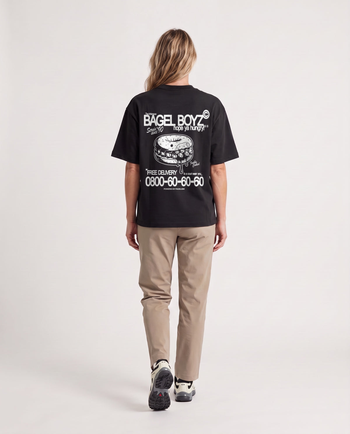 Bagel Boyz - Heavyweight T-shirt in Black, worn on model, woman, back walk