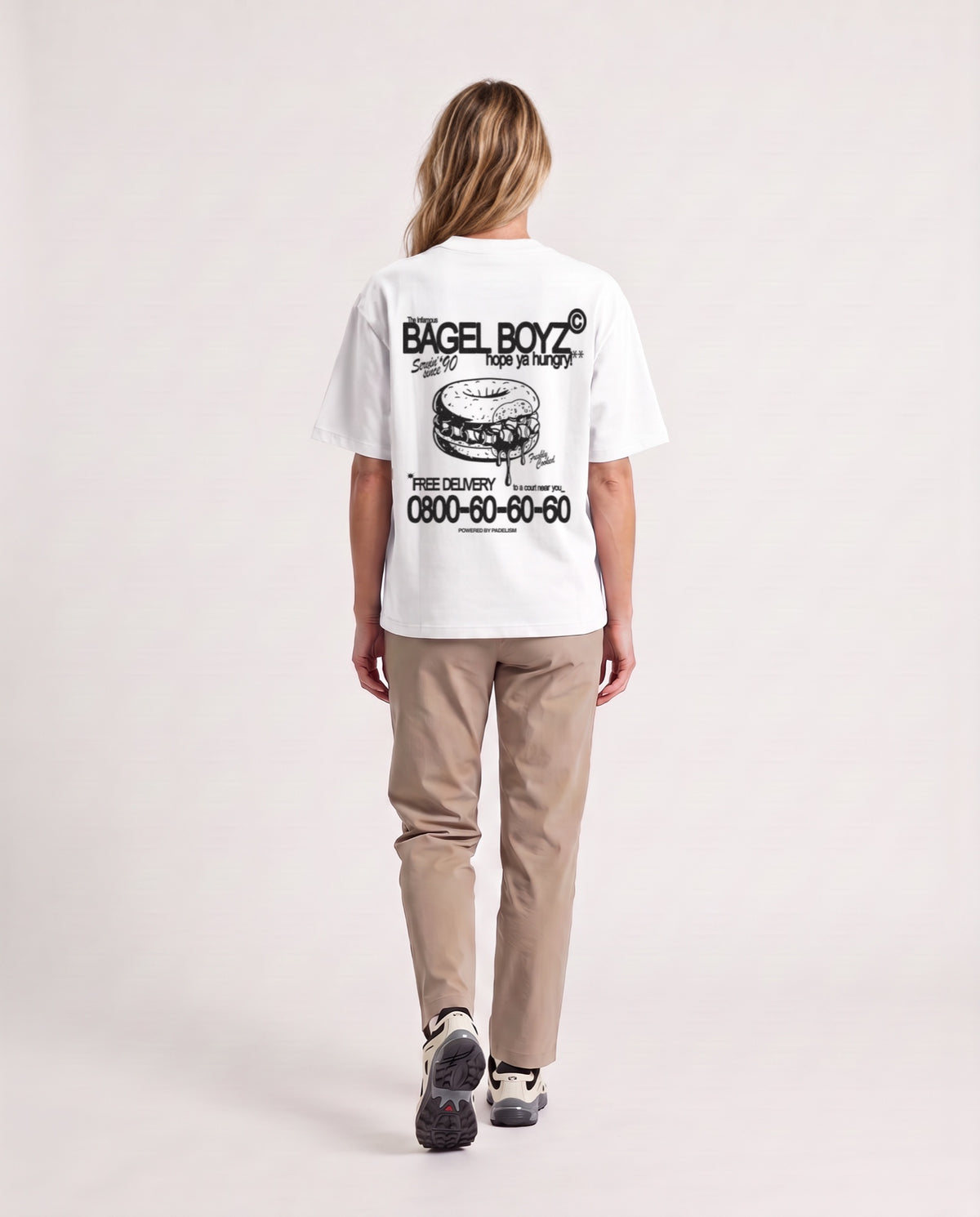 Bagel Boyz - Heavyweight T-shirt in White, worn on model, woman, back walk