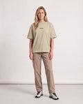 Classic CC - Heavyweight T-shirt in Sand Color, worn on model, woman, front