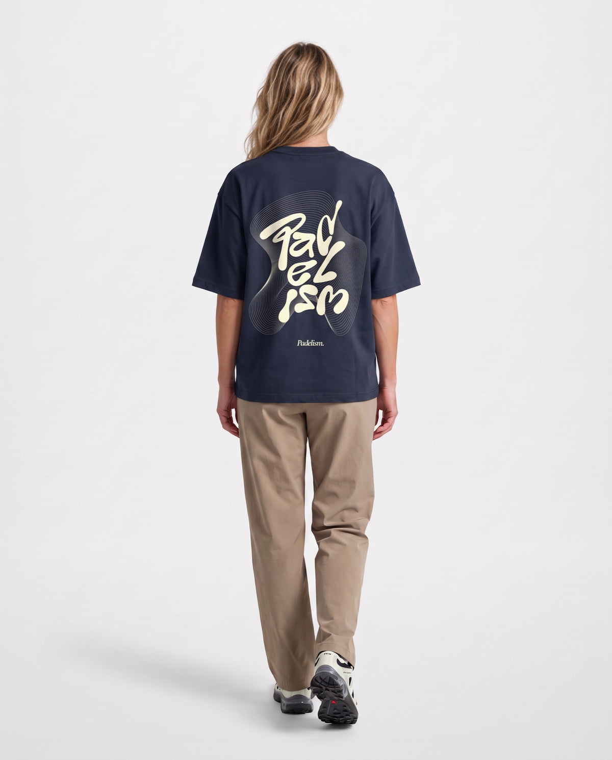 Flow - Heavyweight T-Shirt in Navy, worn on model, woman, back walk