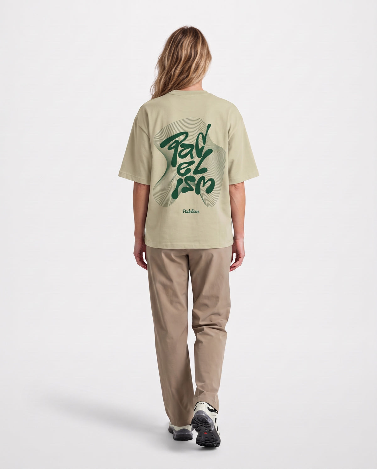 Flow - Heavyweight T-Shirt in Sand Color, worn on model, woman, back walk