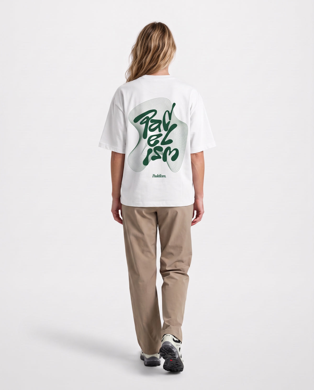 Flow - Heavyweight T-Shirt in White, worn on model, woman, back walk