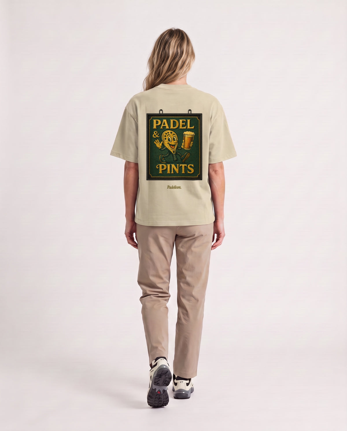 Swing Sign - Heavyweight T-Shirt in Sand Color, worn on model, woman, back walk