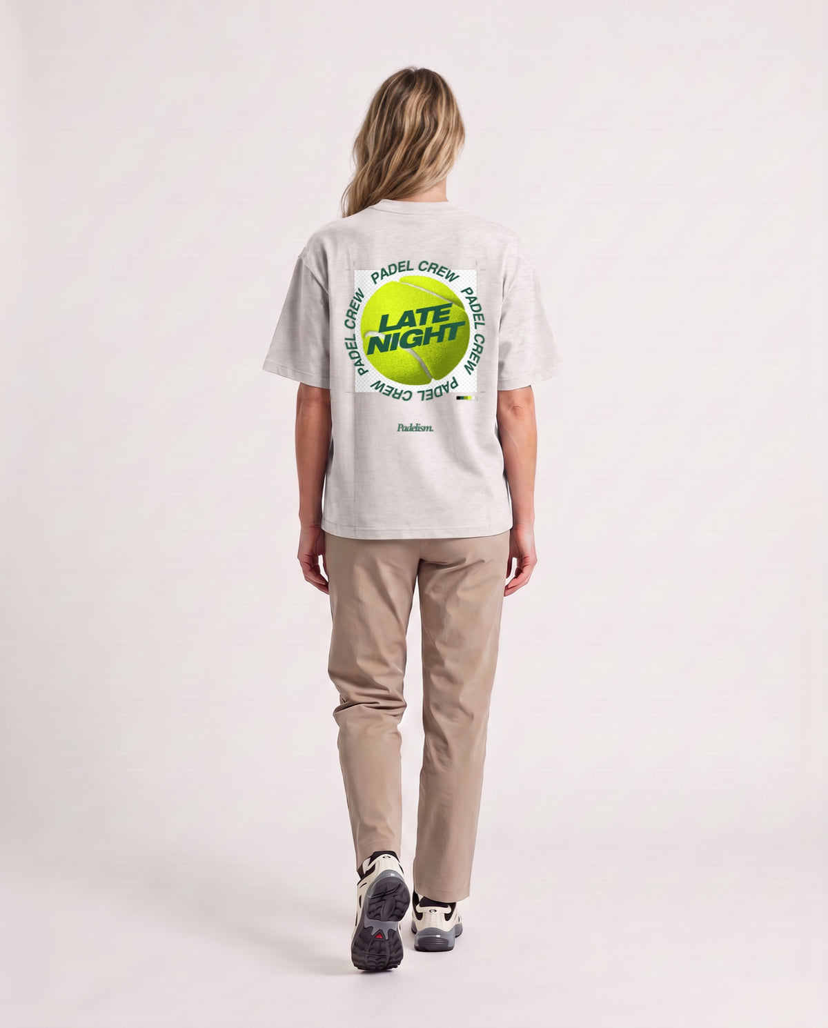 PNG - Heavyweight T-Shirt in Oat Gray, worn on model, woman, back walk