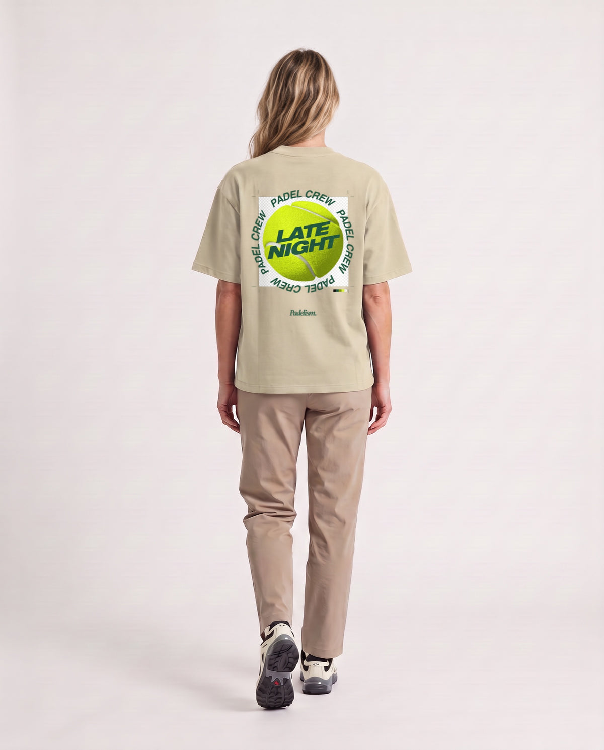 PNG - Heavyweight T-Shirt in Sand Color, worn on model, woman, back walk