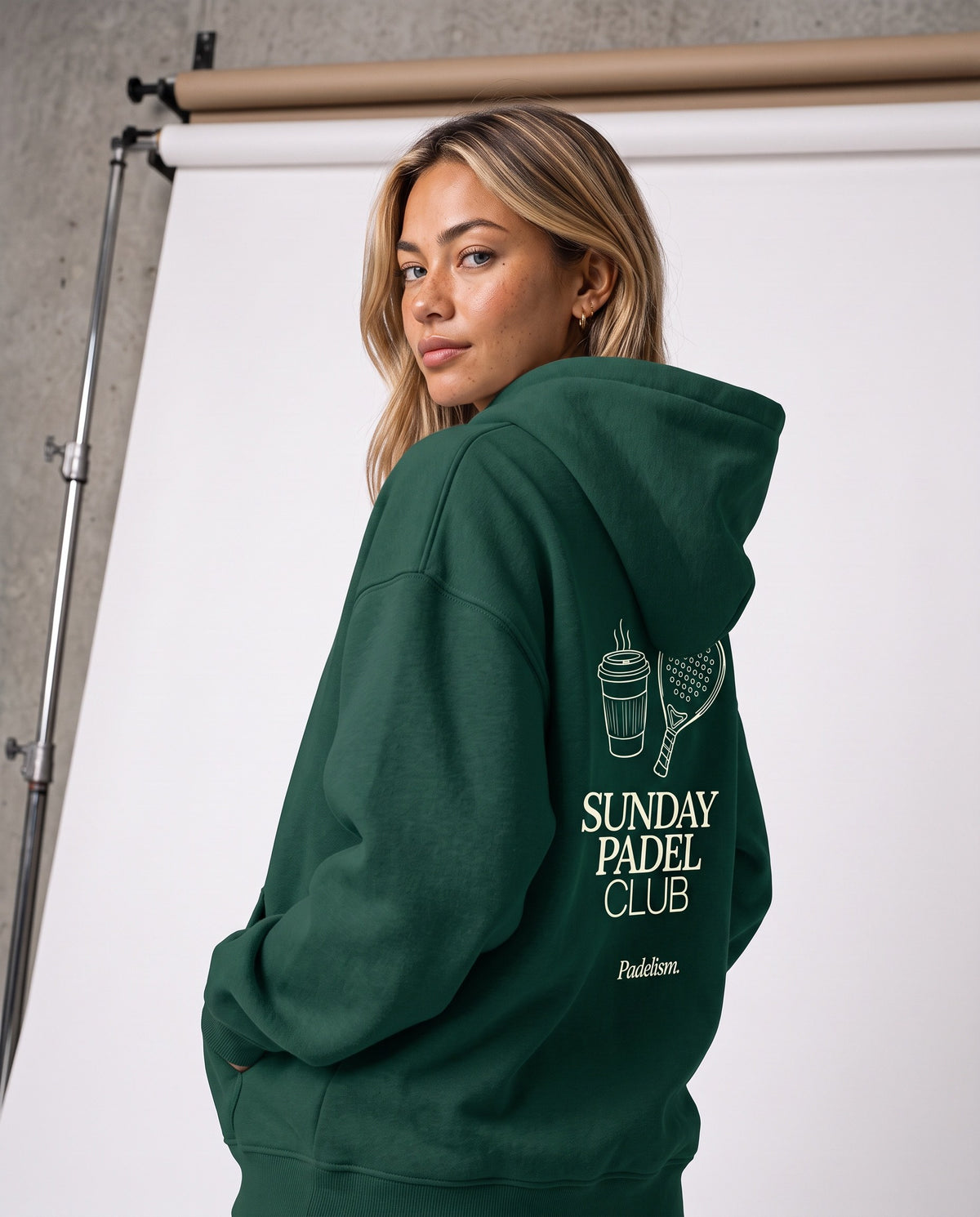 Model in the Sunday Padel Club Hoodie in Eden Green