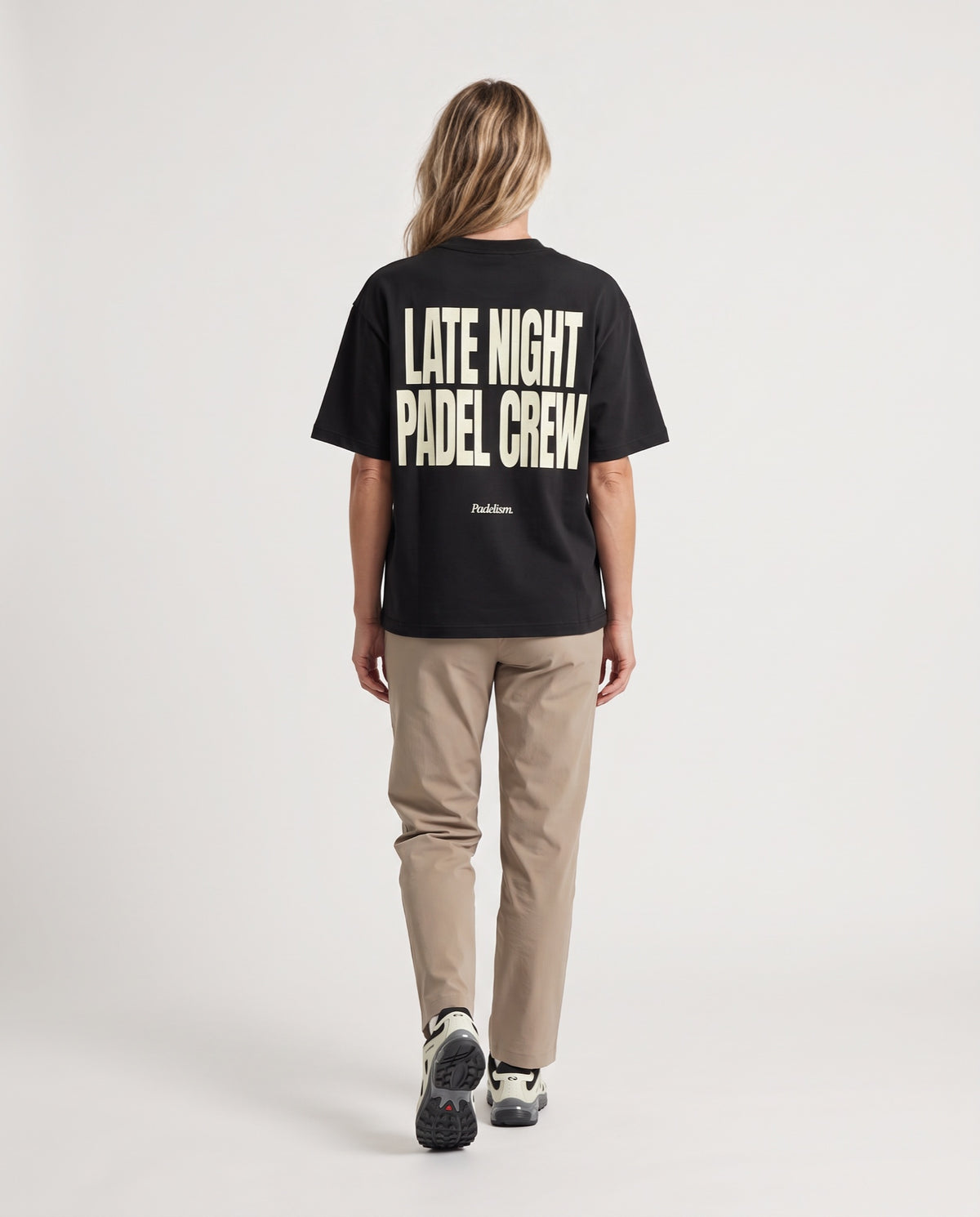 LNPC - Heavyweight T-Shirt in Black, worn on model, woman, back walk