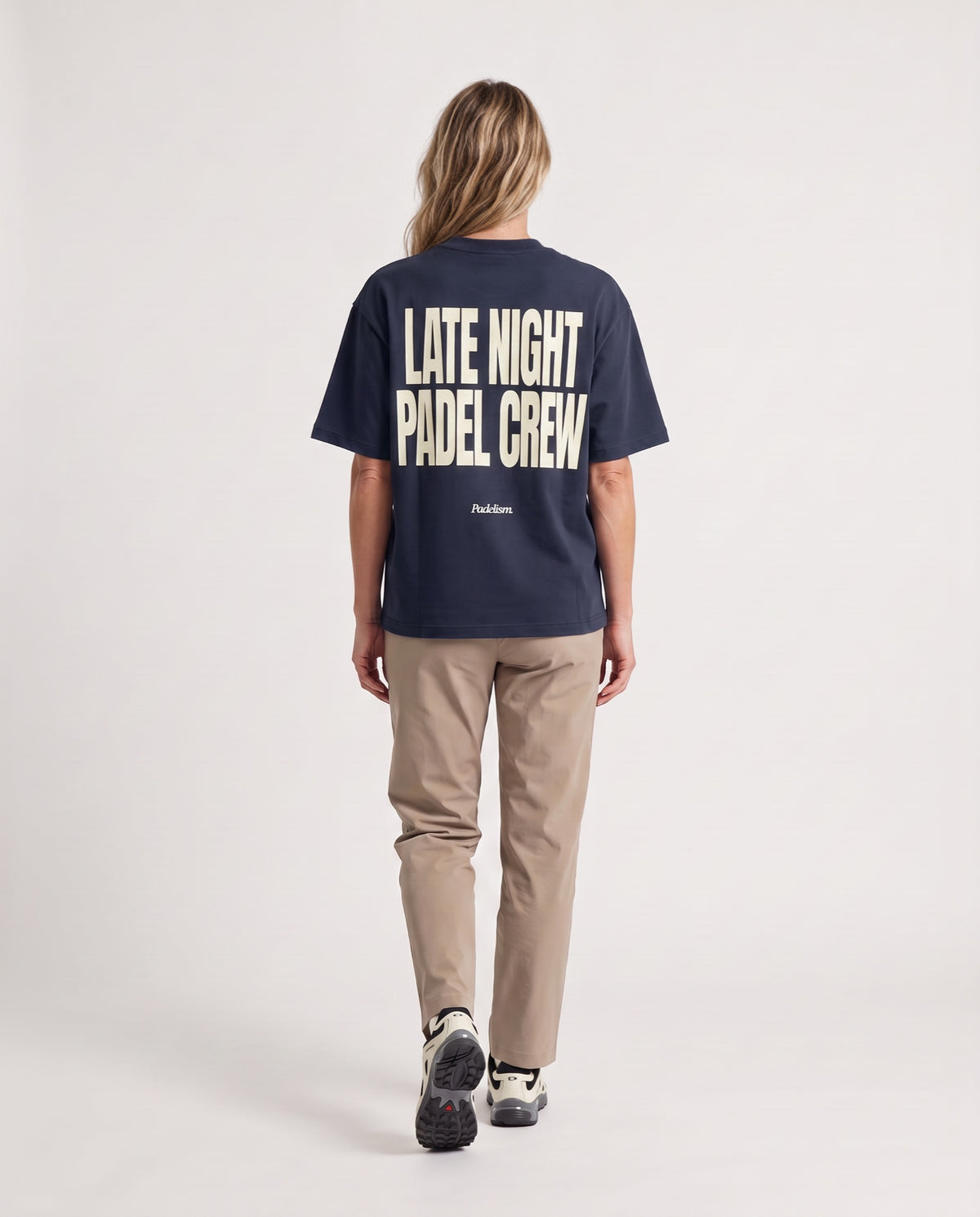 LNPC - Heavyweight T-Shirt in Navy, worn on model, woman, back walk