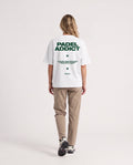 Padel Addict - Heavyweight T-Shirt in White, worn on model, woman, back walk
