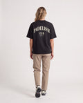 Padelism Club 25 - Heavyweight T-Shirt in Black, worn on model, woman, back walk
