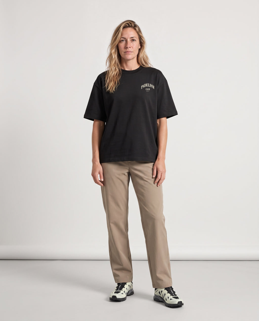 Padelism Club 25 - Heavyweight T-Shirt in Black, worn on model, woman, front