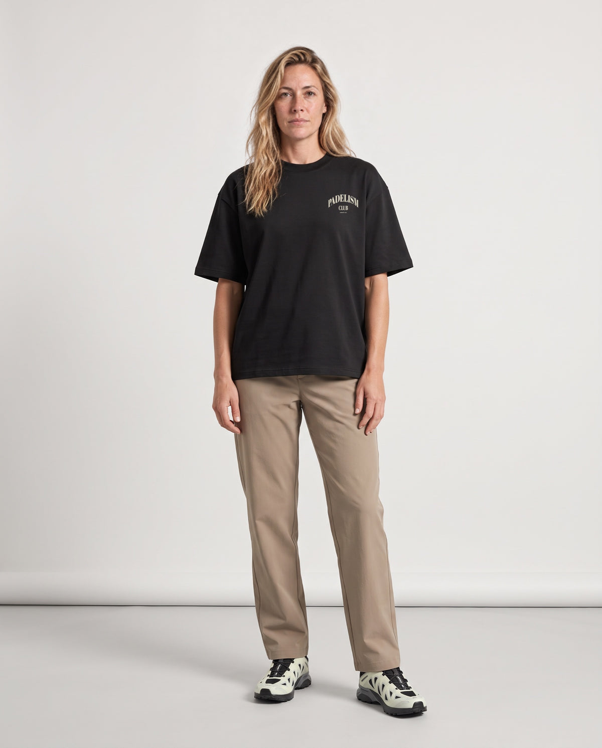 Padelism Club 25 - Heavyweight T-Shirt in Black, worn on model, woman, front