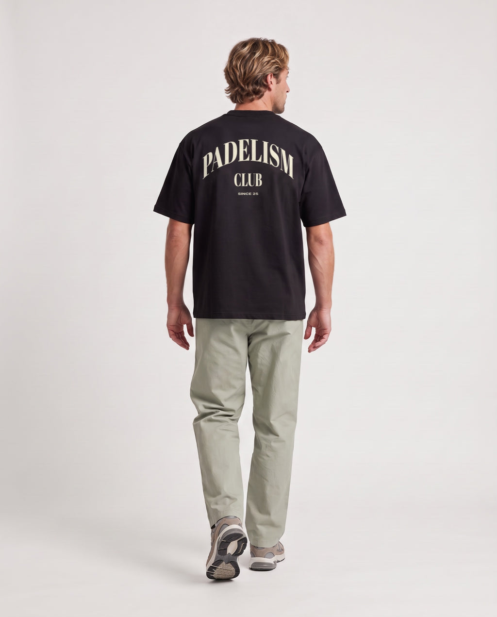 Padelism Club 25 - Heavyweight T-Shirt in Black, worn on model, man, back walk