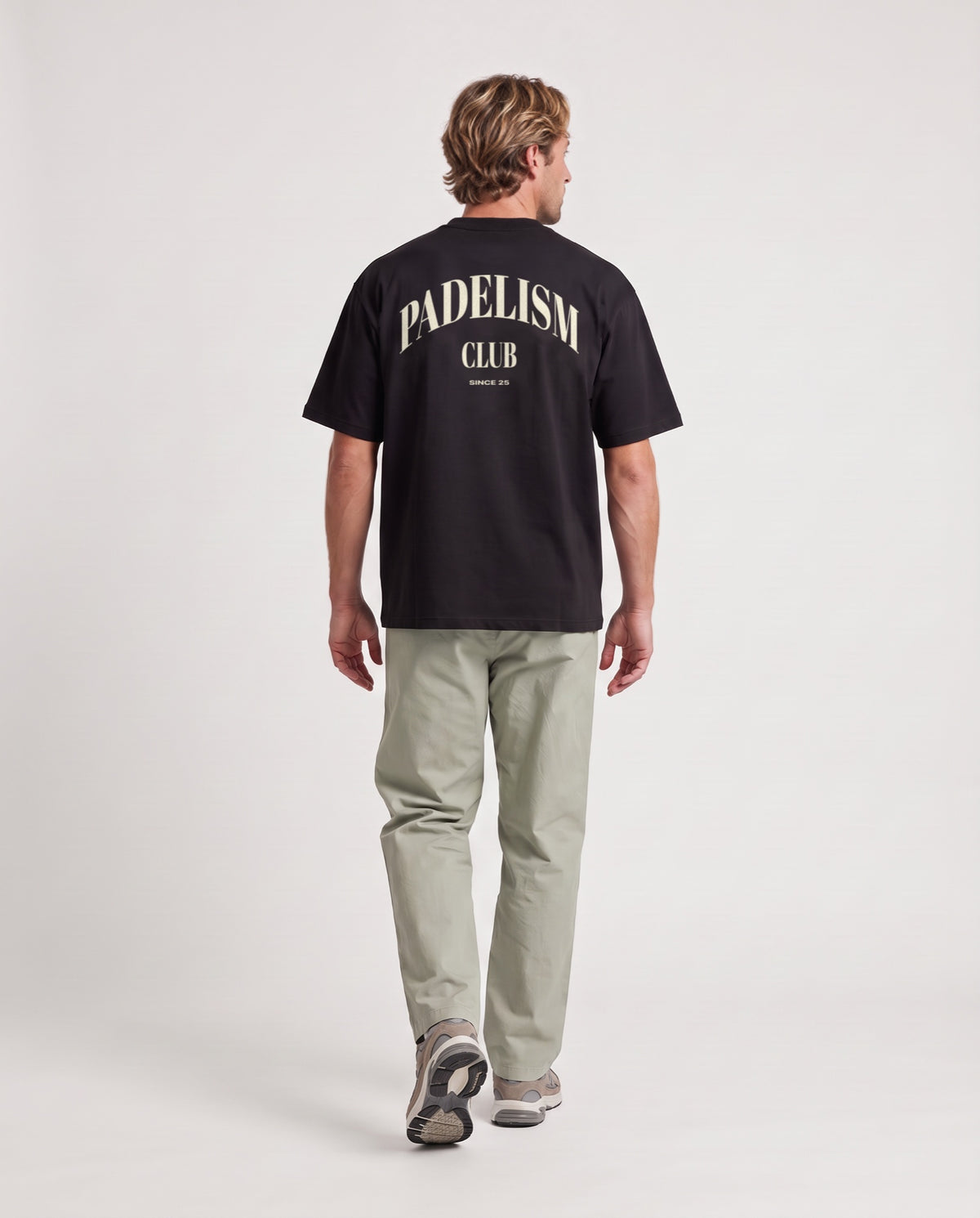 Padelism Club 25 - Heavyweight T-Shirt in Black, worn on model, man, back walk