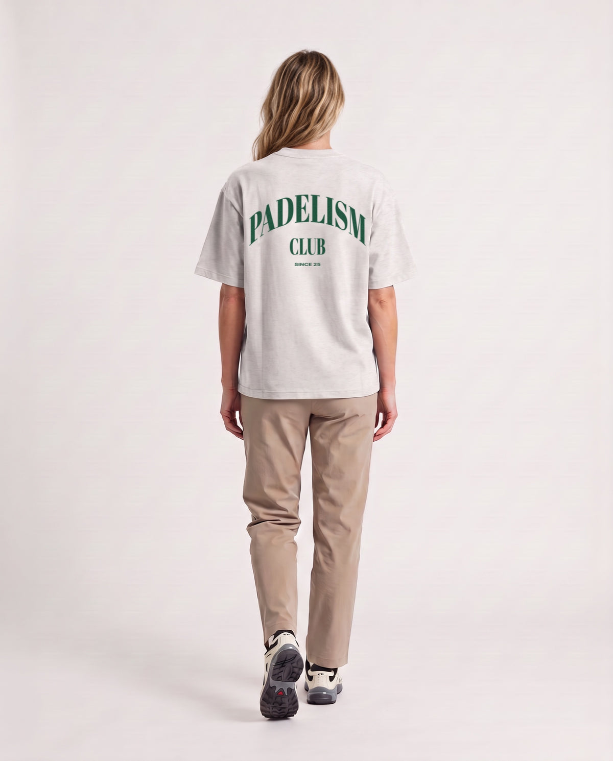 Padelism Club 25 - Heavyweight T-Shirt in Oat Gray, worn on model, woman, back walk