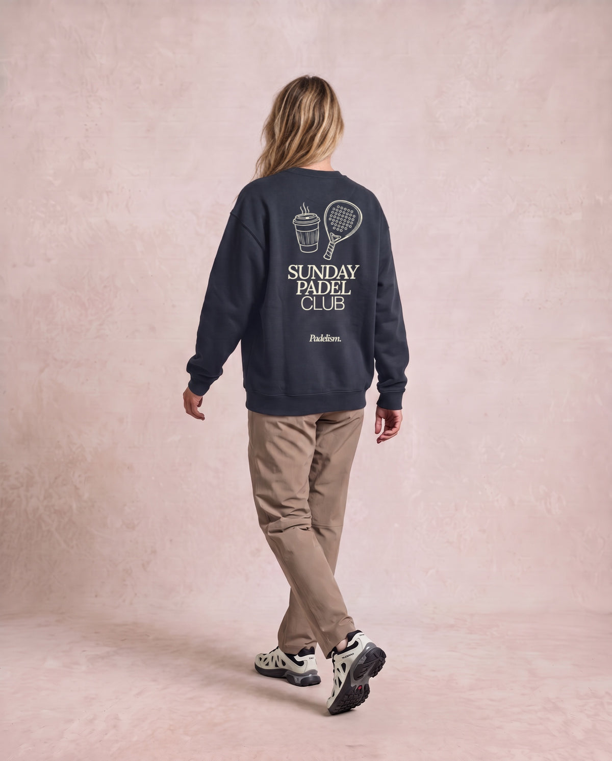 Sunday Padel Club Sweatshirt in Navy Blue, worn on model, woman, back walk