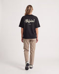 Vibe - Heavyweight T-Shirt in Black, worn on model, woman, back walk