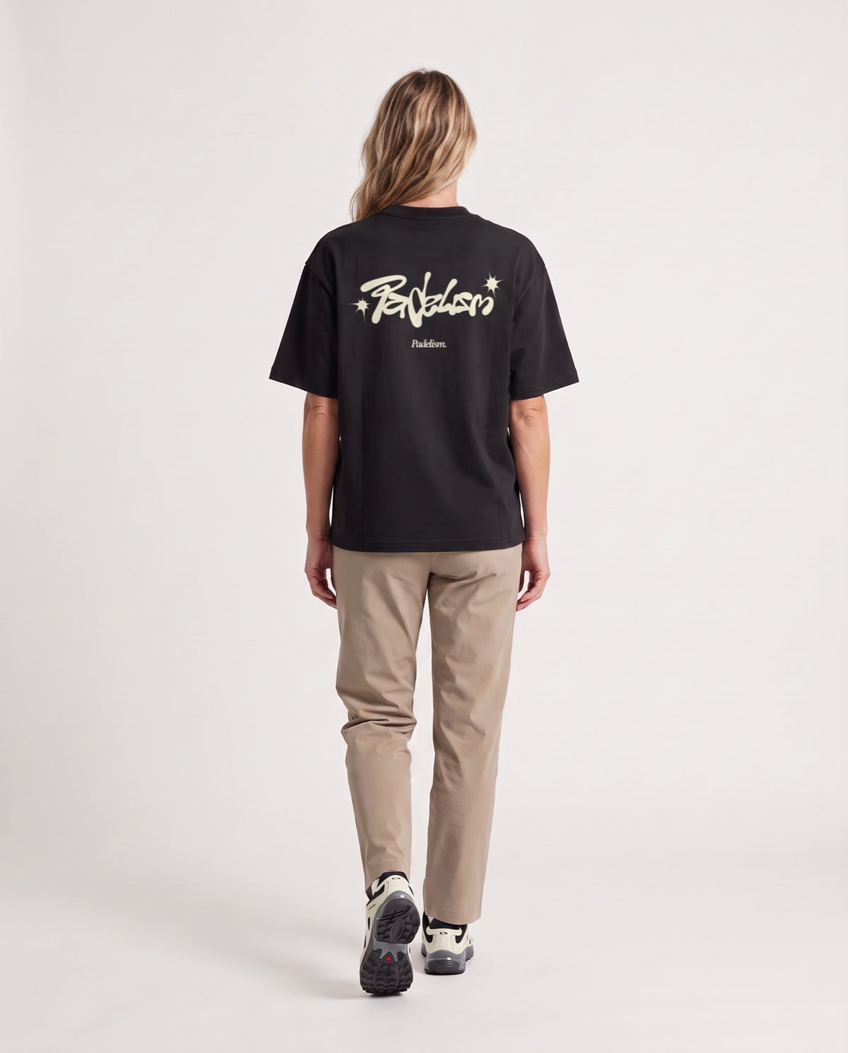 Vibe - Heavyweight T-Shirt in Black, worn on model, woman, back walk
