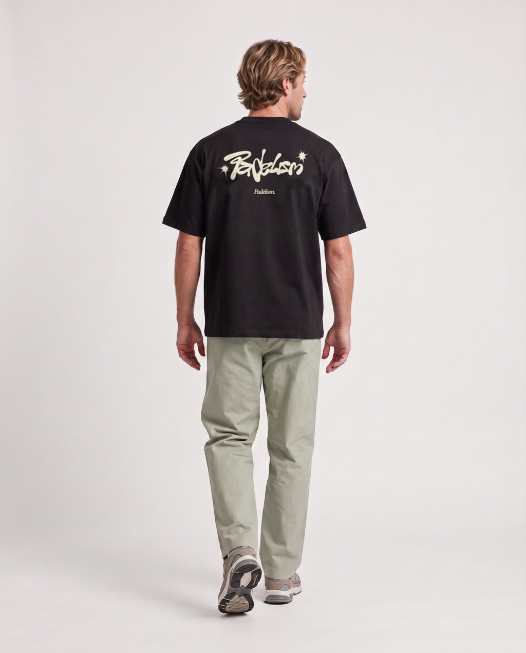 Vibe - Heavyweight T-Shirt in Black, worn on model, man, back walk